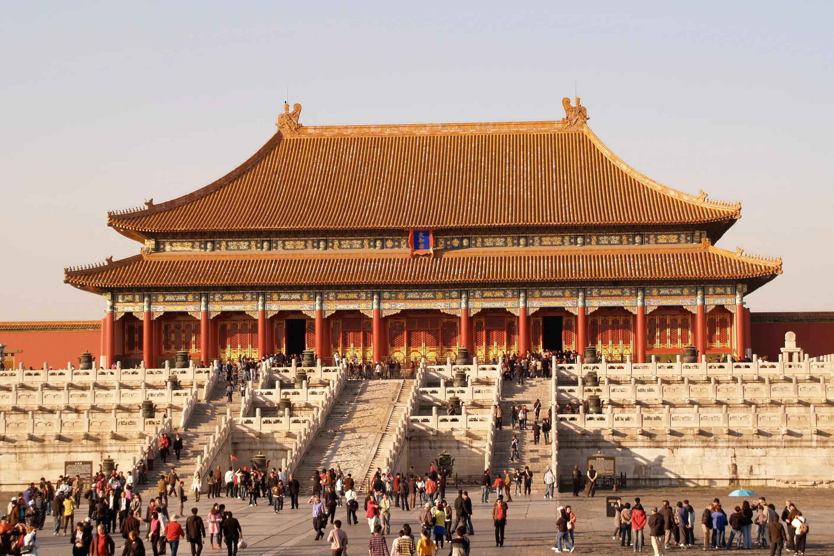 The Hall of Supreme Harmony, a symmetrical golden-roofed hall on tiered white marble terraces above a vast courtyard