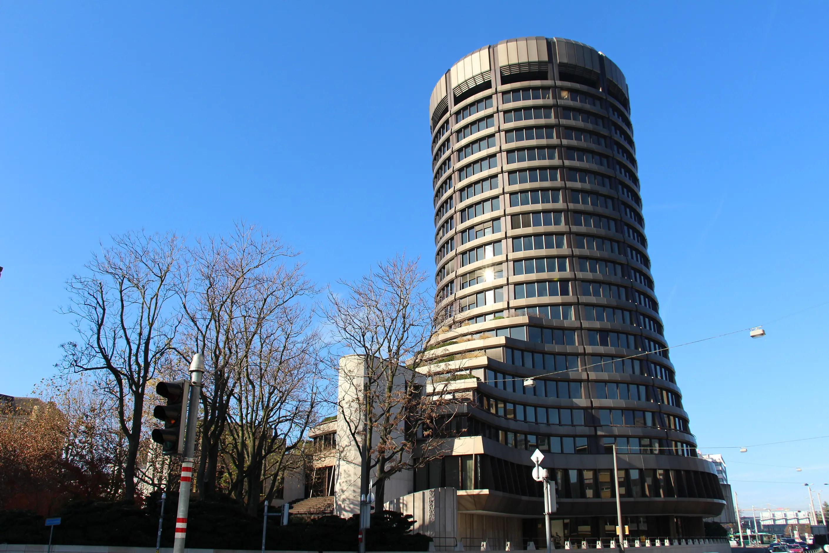 Round tower of the Bank for International Settlements rising above Basel's rooftops