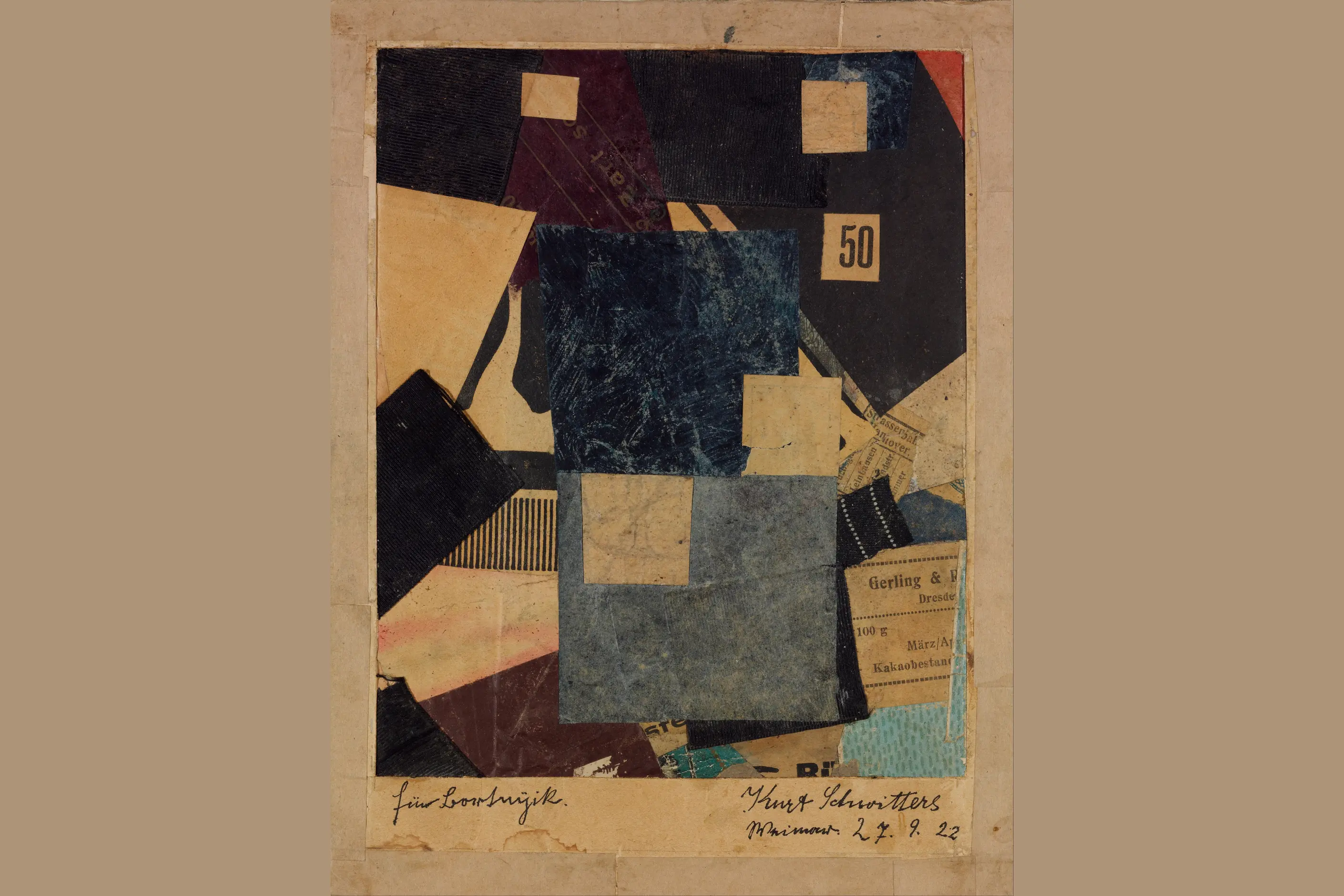 Geometric collage layering fabric, coloured paper and a printed number fifty