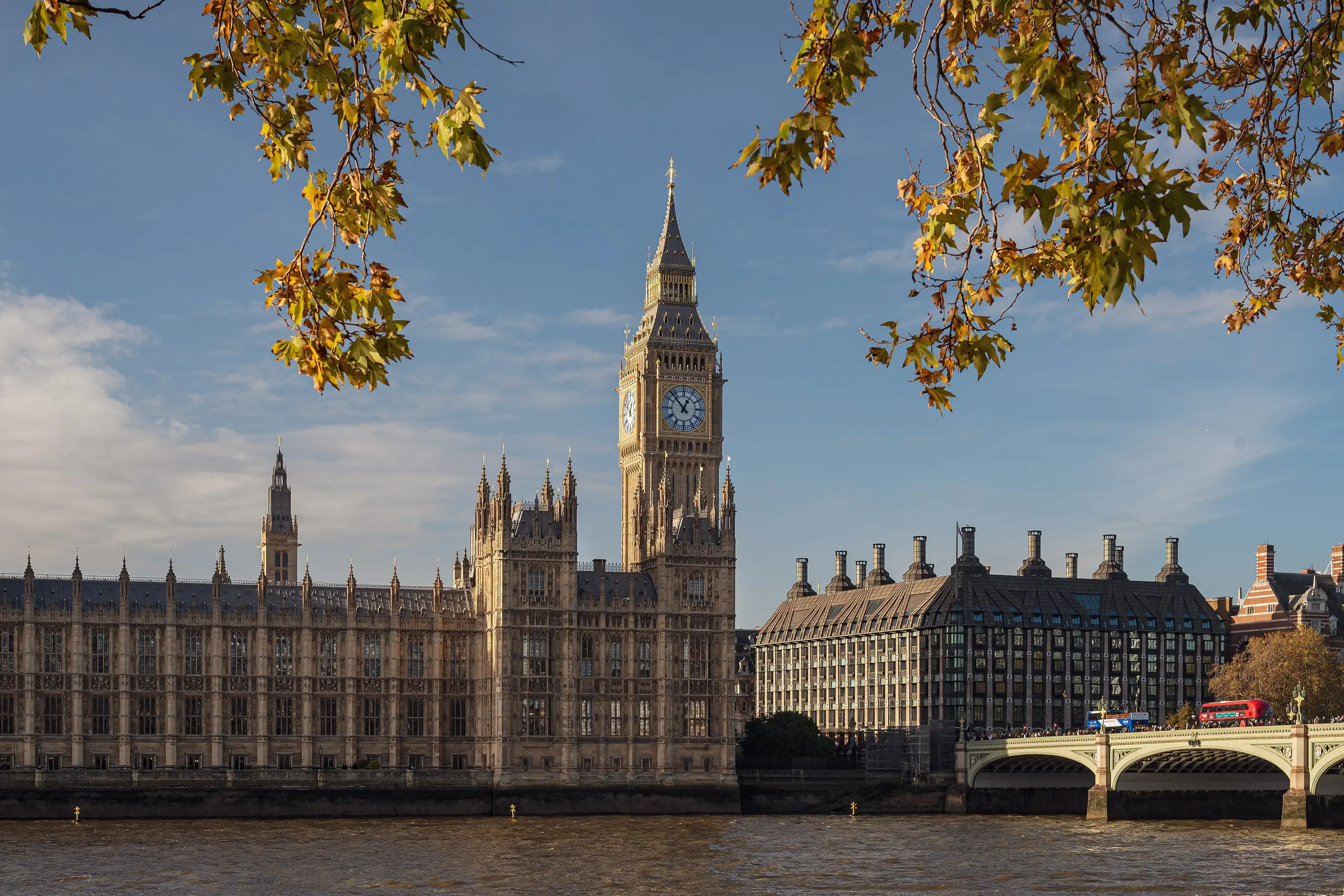 Palace of Westminster with its Gothic Revival clock tower seen across the River Thames