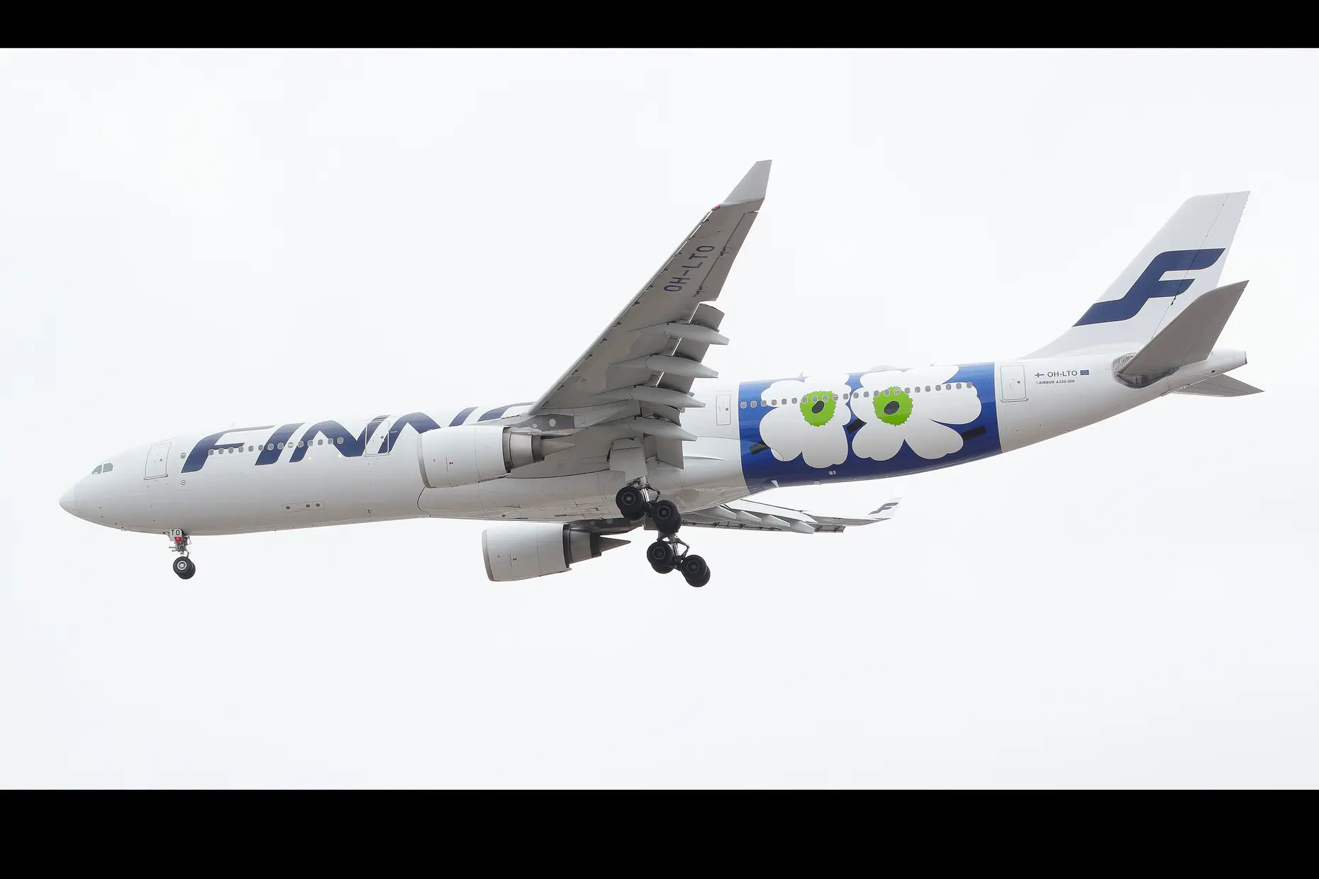 Finnair passenger plane in flight with the Marimekko Unikko poppy pattern livery