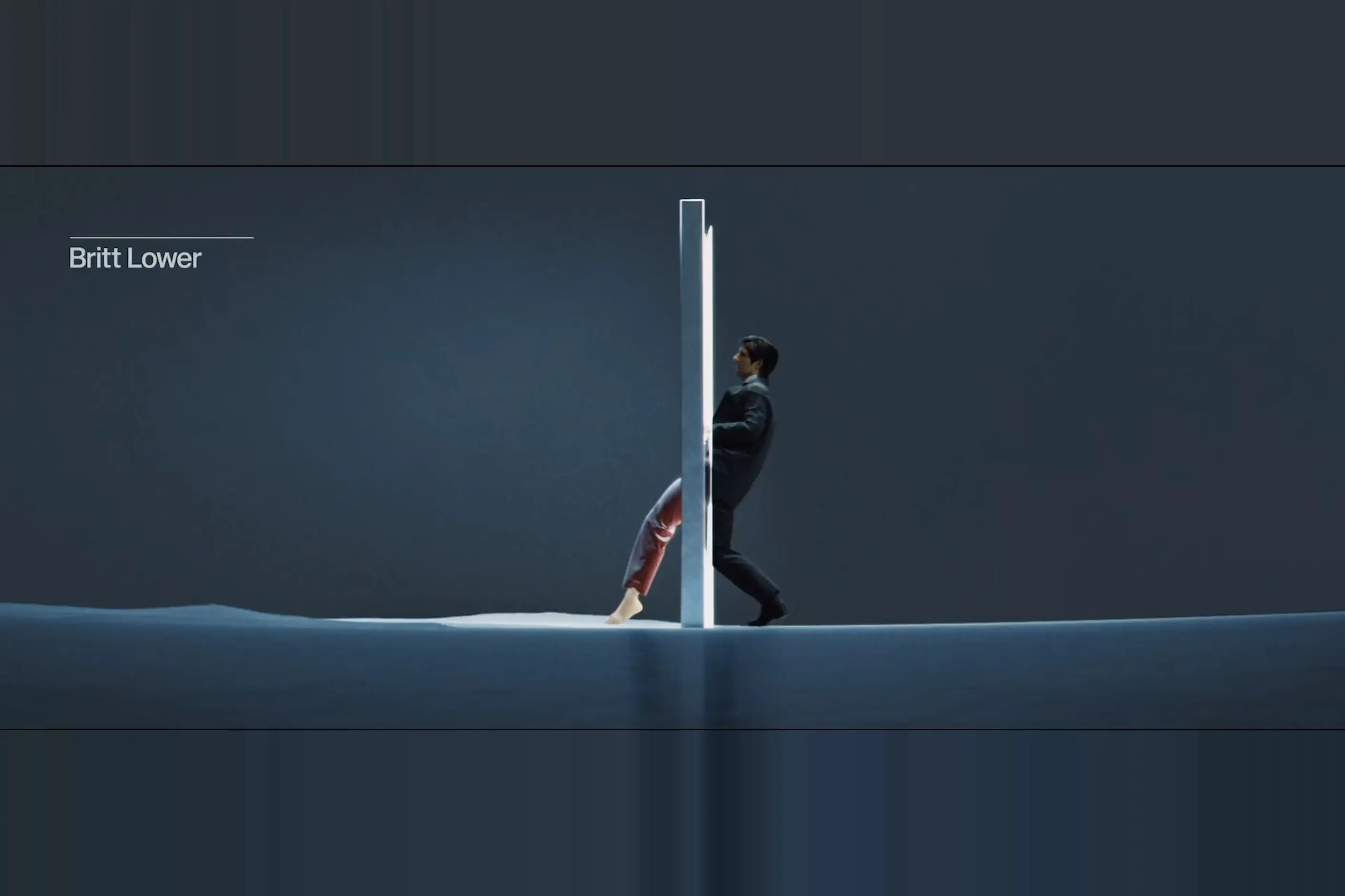 A suited figure steps through a glowing panel, swapping into pyjama trousers