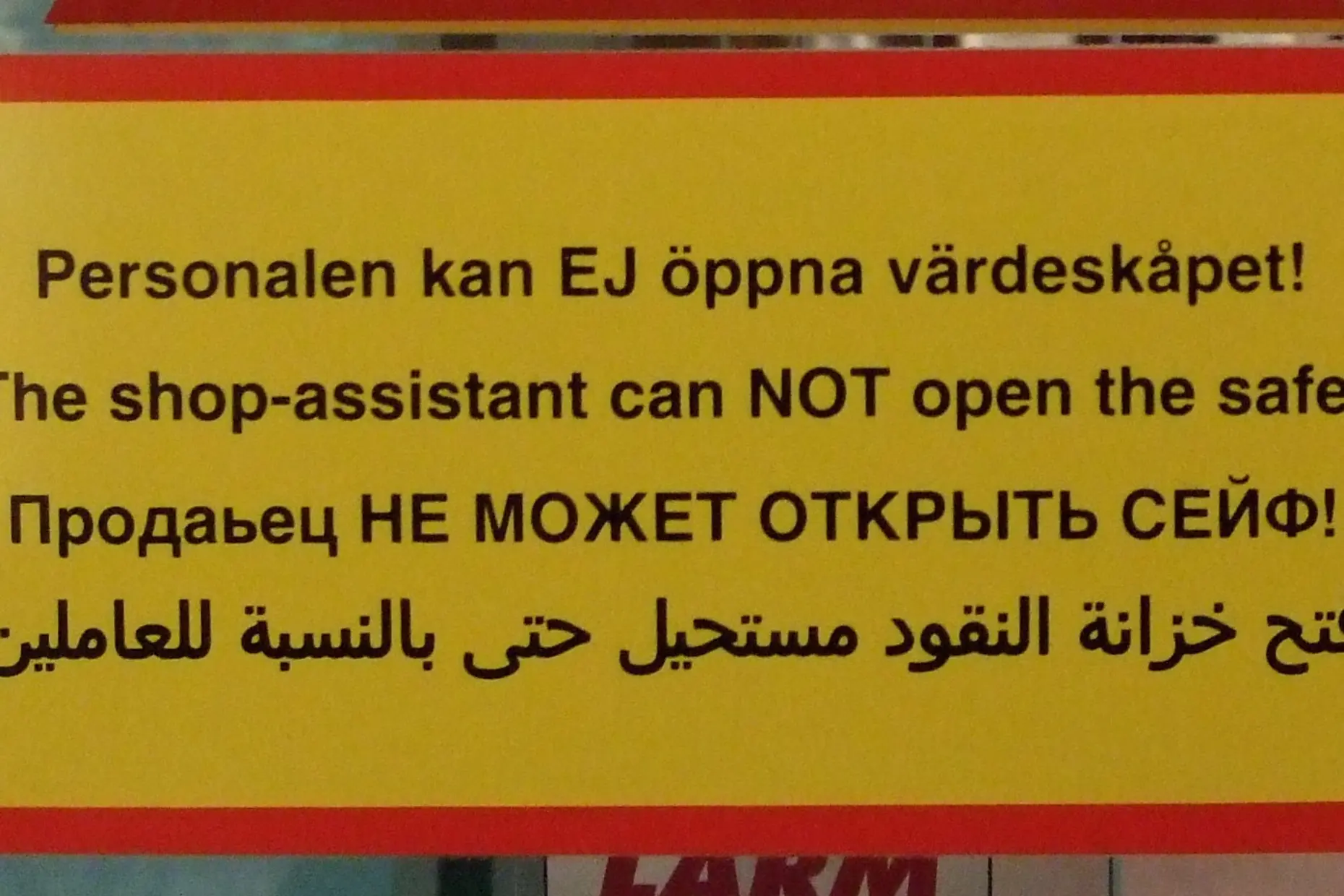 A yellow warning sign repeating the same message in Swedish, English, Russian and Arabic
