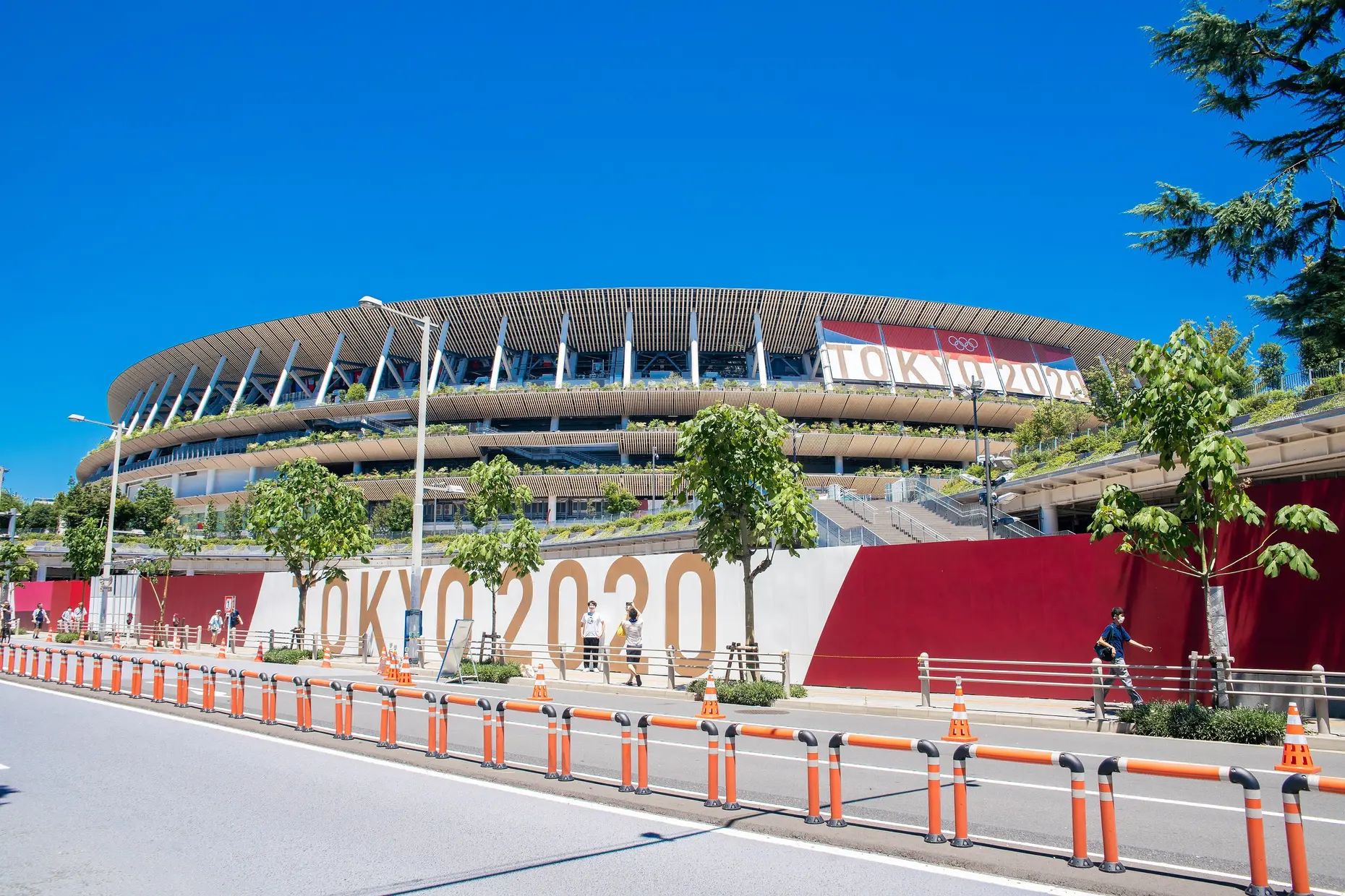 Japan National Stadium with tiered wooden lattice eaves layered around its curved exterior