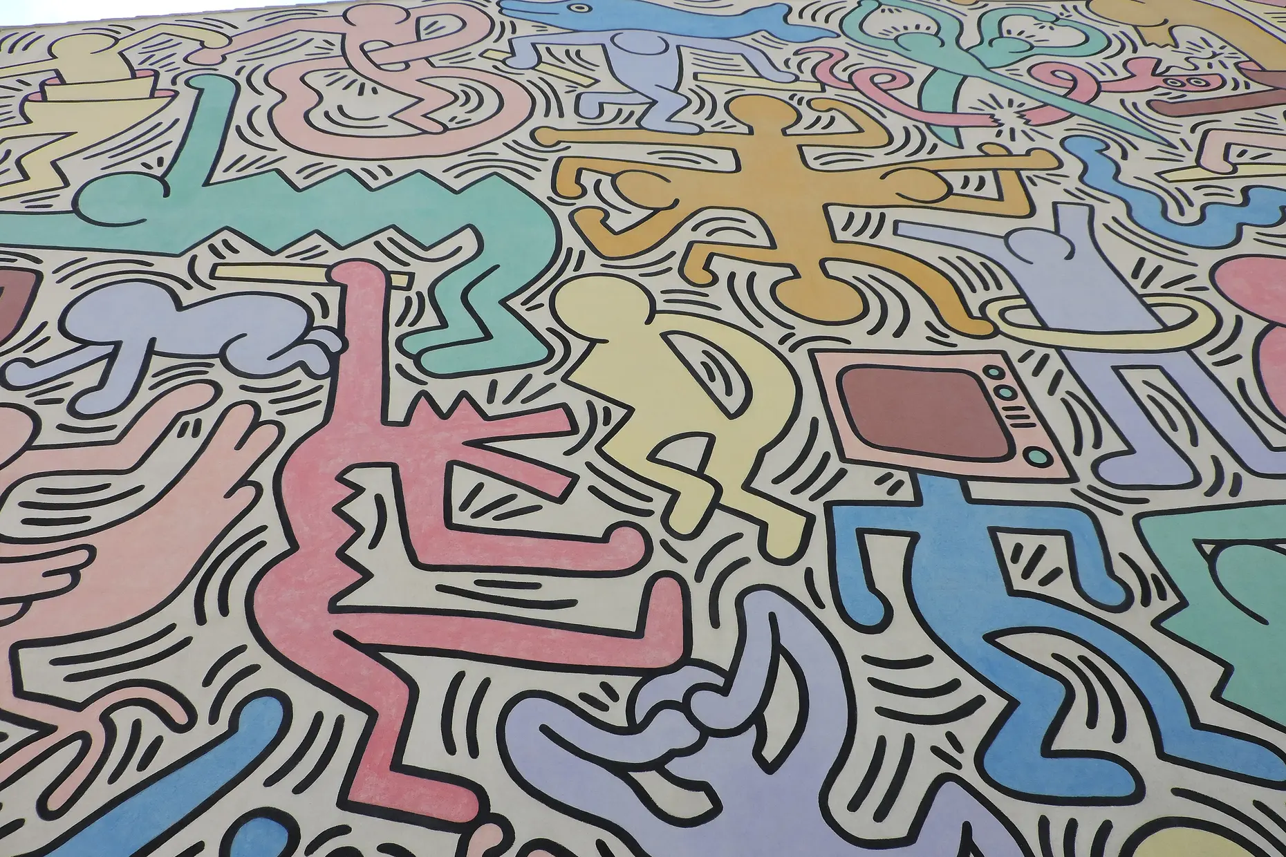 A wall mural packed with interlocking cartoon figures in pastel pinks, blues, yellows and greens, outlined in black